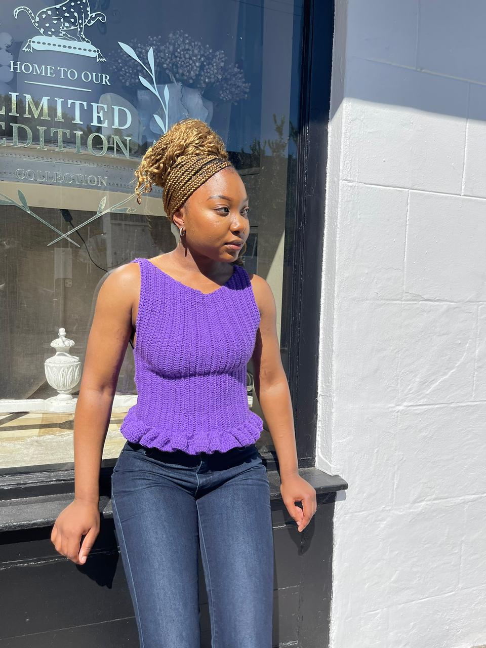 Woman in purple crochet top, front view